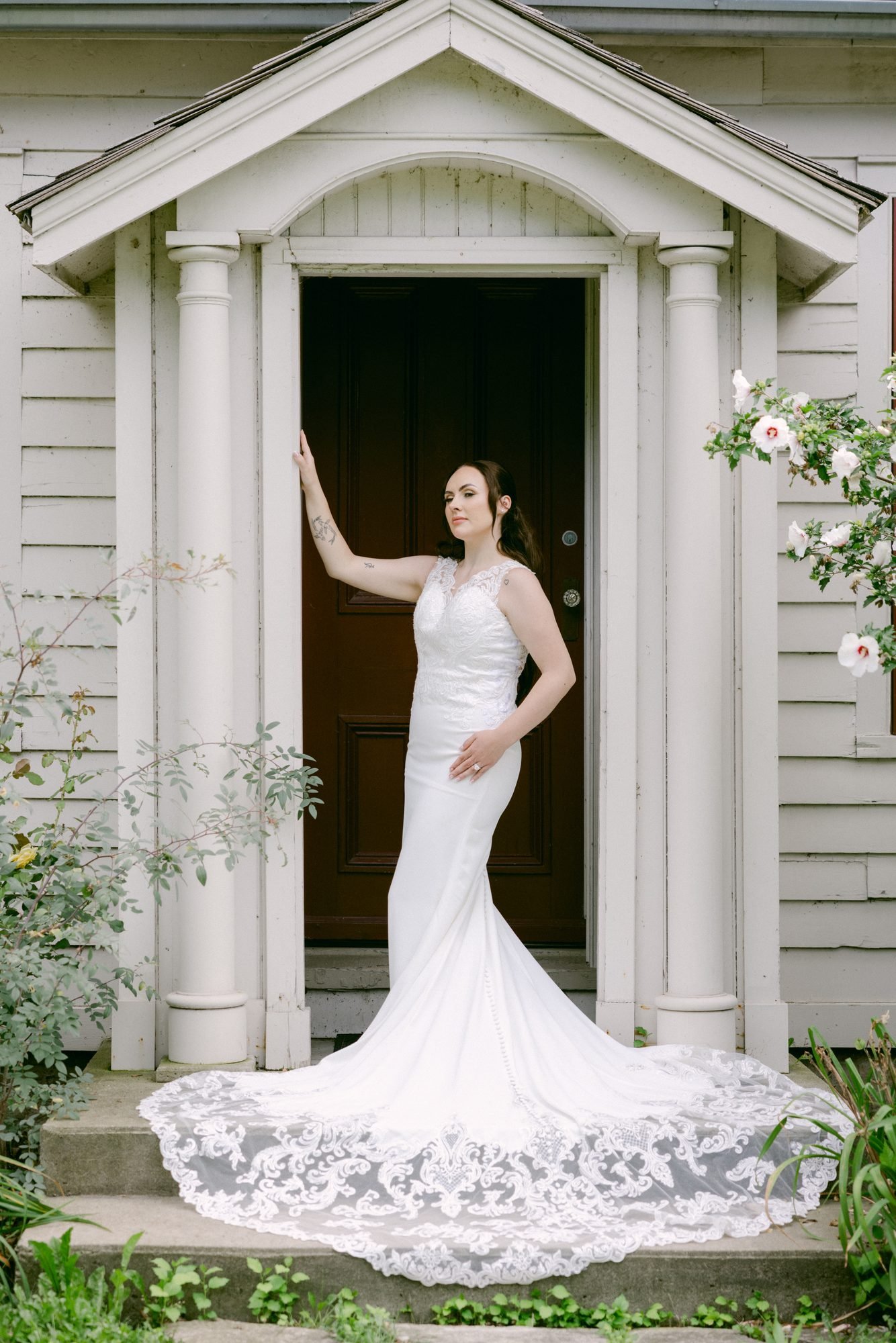 Olivia in her gown at the front doors of the venue